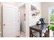 Cozy breakfast nook with seating and direct access to laundry room and outdoor deck at 6507 Revolutionary Trl, Charlotte, NC 28217