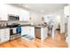 Well-appointed kitchen flows into the open-concept living space with granite countertops and stainless appliances at 6507 Revolutionary Trl, Charlotte, NC 28217