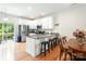 Well-lit kitchen with granite countertops, stainless steel appliances, a kitchen island and breakfast bar seating at 6507 Revolutionary Trl, Charlotte, NC 28217