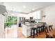 Contemporary kitchen with stainless steel appliances, a breakfast bar, and access to a deck at 6507 Revolutionary Trl, Charlotte, NC 28217
