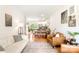 Inviting open-concept living room featuring hardwood floors, comfortable seating, and abundant natural light at 6507 Revolutionary Trl, Charlotte, NC 28217