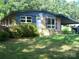 A quaint single-story brick home featuring well-maintained landscaping and a covered carport at 761 Henry Rhodes Rd, Lincolnton, NC 28092