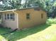 A single-story brick home with a simple design and small windows on the side at 761 Henry Rhodes Rd, Lincolnton, NC 28092