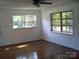 Bright living room featuring hardwood floors, white walls, large windows, and ample natural light at 761 Henry Rhodes Rd, Lincolnton, NC 28092