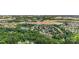 Scenic aerial view of a neighborhood near a pond, commercial area, and dense greenery, perfect for convenience at 825 Rock Lake Gln, Fort Mill, SC 29715