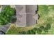 Aerial view of townhome rooftops amidst green lawns and trees, showcasing a serene neighborhood setting at 825 Rock Lake Gln, Fort Mill, SC 29715