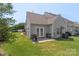 A cozy backyard area with a grill, small patio, and well-maintained lawn, great for outdoor relaxation at 825 Rock Lake Gln, Fort Mill, SC 29715