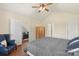 Bedroom offers vaulted ceilings, a chair near a window, and doors leading to other areas at 825 Rock Lake Gln, Fort Mill, SC 29715