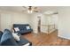 Open bonus room with hardwood floors, neutral walls, and a view of the staircase at 825 Rock Lake Gln, Fort Mill, SC 29715