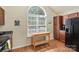 Kitchen with wood-look flooring, a large window, wooden cabinets, and black refrigerator at 825 Rock Lake Gln, Fort Mill, SC 29715