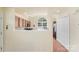 Partial view of kitchen area that features bar seating and flows into other spaces at 825 Rock Lake Gln, Fort Mill, SC 29715