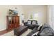 Living room featuring modern sofa, ottoman, and large cabinet entertainment center at 825 Rock Lake Gln, Fort Mill, SC 29715