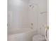 Bathroom featuring a shower and tub combo, toilet, and grab bar at 8465 Olde Troon Dr, Charlotte, NC 28277