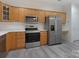 Kitchen with stainless steel appliances, including a refrigerator and oven, and modern countertops at 8465 Olde Troon Dr, Charlotte, NC 28277