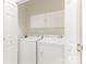 Bright laundry room features a washer, dryer, and built-in storage cabinets for optimal organization at 8465 Olde Troon Dr, Charlotte, NC 28277