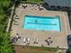A refreshing community pool with clear blue water and plenty of lounge seating around the deck at 8465 Olde Troon Dr, Charlotte, NC 28277