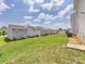 This expansive backyard view shows well-maintained lawn spaces and neighboring houses, ideal for outdoor gatherings at 9136 Creedmore Hills Dr, Charlotte, NC 28214