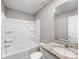 This bathroom features a granite countertop and a shower-tub combo at 9136 Creedmore Hills Dr, Charlotte, NC 28214