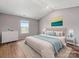 Comfortable bedroom with a vaulted ceiling, wood floors, a window, and tasteful decor at 9136 Creedmore Hills Dr, Charlotte, NC 28214