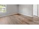 Cozy bedroom with wood floors and a large window offering pleasant views at 9136 Creedmore Hills Dr, Charlotte, NC 28214