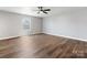 Bedroom featuring wood floors, neutral walls, ceiling fan, and natural light at 9136 Creedmore Hills Dr, Charlotte, NC 28214