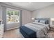 Bedroom features a large window, stylish furniture, and a soothing color palette at 9136 Creedmore Hills Dr, Charlotte, NC 28214