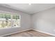 Bedroom features a large window, providing ample natural light and views of the outdoors at 9136 Creedmore Hills Dr, Charlotte, NC 28214