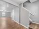 Open concept entryway with wood floors, neutral walls, and staircase to the second floor at 9136 Creedmore Hills Dr, Charlotte, NC 28214