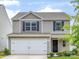 Charming two-story home with a two car garage, landscaped yard, and neutral siding at 9136 Creedmore Hills Dr, Charlotte, NC 28214
