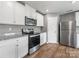 Bright kitchen featuring an oven, microwave, and stainless refrigerator at 9136 Creedmore Hills Dr, Charlotte, NC 28214