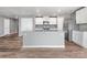 A kitchen area features an island, and modern stainless steel appliances at 9136 Creedmore Hills Dr, Charlotte, NC 28214