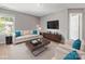 Bright living room with hardwood floors, stylish decor, and large windows for abundant natural light at 9136 Creedmore Hills Dr, Charlotte, NC 28214