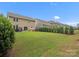 Spacious backyard featuring lush green grass, landscaping and is perfect for Gathering gatherings and recreation at 1008 Whipcord Dr, Waxhaw, NC 28173