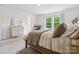 Bedroom featuring an adjacent study nook, neutral decor, carpet and a sunlit window at 1008 Whipcord Dr, Waxhaw, NC 28173
