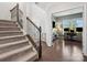 Spacious foyer with staircase leading to an office, showcasing hardwood floors at 1008 Whipcord Dr, Waxhaw, NC 28173