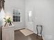 Welcoming foyer with hardwood floors, decorative window, and elegant accents at 1008 Whipcord Dr, Waxhaw, NC 28173