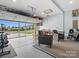 View of the garage with an open garage door and seating area at 1008 Whipcord Dr, Waxhaw, NC 28173