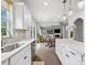 Bright kitchen with open floor plan connecting dining and living areas, stainless appliances at 1008 Whipcord Dr, Waxhaw, NC 28173