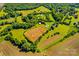 Verdant acreage featuring manicured fields, scattered trees, outbuildings and a private, serene setting at 1043 Linneys Mill Rd, Union Grove, NC 28689