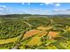 Expansive land with approximated property lines showcasing rolling hills, fertile fields, and wooded areas at 1043 Linneys Mill Rd, Union Grove, NC 28689