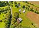 Sprawling farm features barns, fields, and charming rural setting nestled amongst picturesque trees at 1043 Linneys Mill Rd, Union Grove, NC 28689