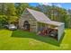 Aerial view of barn with equipment and vehicles sheltered at 1043 Linneys Mill Rd, Union Grove, NC 28689