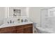 Elegant bathroom with double vanity, modern lighting, and glass enclosed shower at 1043 Linneys Mill Rd, Union Grove, NC 28689