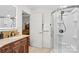 Bathroom featuring a glass-enclosed shower, wood vanity and tiled flooring at 1043 Linneys Mill Rd, Union Grove, NC 28689