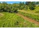 Scenic view of a gently flowing creek surrounded by lush greenery at 1043 Linneys Mill Rd, Union Grove, NC 28689