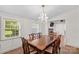 Elegant dining room featuring a large wooden table and a decorative chandelier at 1043 Linneys Mill Rd, Union Grove, NC 28689