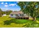 Exterior backyard view of the home with a wooden deck at 1043 Linneys Mill Rd, Union Grove, NC 28689