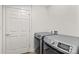 Laundry room with modern front loading washer and dryer at 1043 Linneys Mill Rd, Union Grove, NC 28689