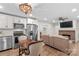 Open floor plan showcasing the kitchen and living room with a brick fireplace at 1043 Linneys Mill Rd, Union Grove, NC 28689