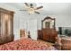 Spacious main bedroom with a carved four-poster bed and adjoining living space at 1043 Linneys Mill Rd, Union Grove, NC 28689